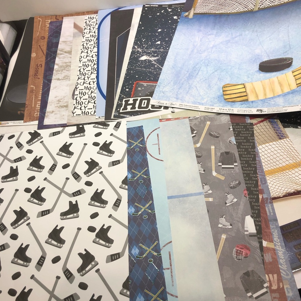 21 Sheets of Discontinued hockey Paper 12 x 12 some have glitter gloss 2 sides